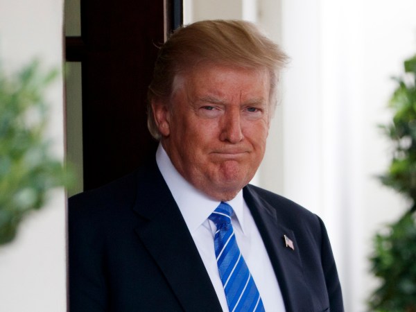 President Donald Trump waits outside the West Wing of the White House for the arrival of Malaysian Prime Minister Najib Razak, Tuesday, Sept. 12, 2017, in Washington. (AP Photo/Evan Vucci)