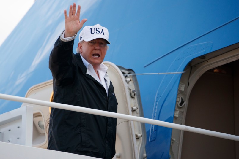 President Donald Trump waves as he boards Air Force One for a trip to Florida to meet with first responders and people impacted by Hurricane Irma, Thursday, Sept. 14, 2017, in Andrews Air Force Base, Md. (AP Photo/Evan Vucci)