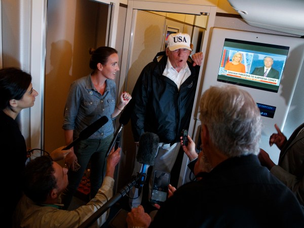 President Donald Trump talks with reporters aboard Air Force One, Thursday, Sept. 14, 2017, en route to Washington. (AP Photo/Evan Vucci)