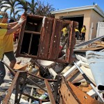 Maria Stotts, and Heather Mueller, volunteers from the Church of Jesus Christ of Latter-Day Saints, clear debris from a Monroe County sheriff's deputy home damaged by a six-foot storm surge at his home, far West in Big Pine Key. Residents were allowed to return to their homes in the Keys today a week after Hurricane Irma struck the Florida Keys.