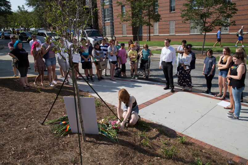 A small group of people gather at a memorial for Georgia Tech student Scout Schultz Sunday, September 17, 2017, In Atlanta GA. Schultz, an engineering student at Georgia Tech, was shot by Georgia Tech campus police near Curran Parking Deck after allegedly wielding a knife and telling officers to shoot him Saturday night. STEVE SCHAEFER / SPECIAL TO THE AJC