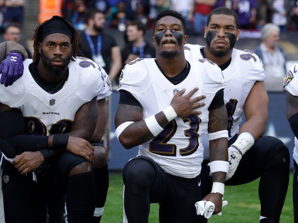 Baltimore Ravens strong safety Tony Jefferson (23) and Baltimore Ravens outside linebacker Matt Judon, left, kneel down with teammates during the playing of the U.S. national anthem before an NFL football game against the Jacksonville Jaguars at Wembley Stadium in London, Sunday Sept. 24, 2017. (AP Photo/Matt Dunham)