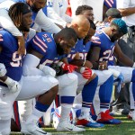 Buffalo Bills players kneel during the national anthem prior to an NFL football game against the Denver Broncos, Sunday, Sept. 24, 2017, in Orchard Park, N.Y. (AP Photo/Jeffrey T. Barnes)