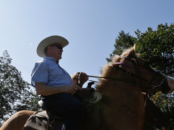 Former Alabama Chief Justice and U.S. Senate candidate Roy Moore, rides in on a horse to vote a the Gallant Volunteer Fire Department, during the Alabama Senate race, Tuesday, Sept. 26, 2017, in Gallant, Ala. (AP Photo/Brynn Anderson)