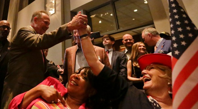 Former Alabama Chief Justice and U.S. Senate candidate Roy Moore, greets supporter Patricia Jones, right, before his election party, Tuesday, Sept. 26, 2017, in Montgomery, Ala.(AP Photo/Brynn Anderson)