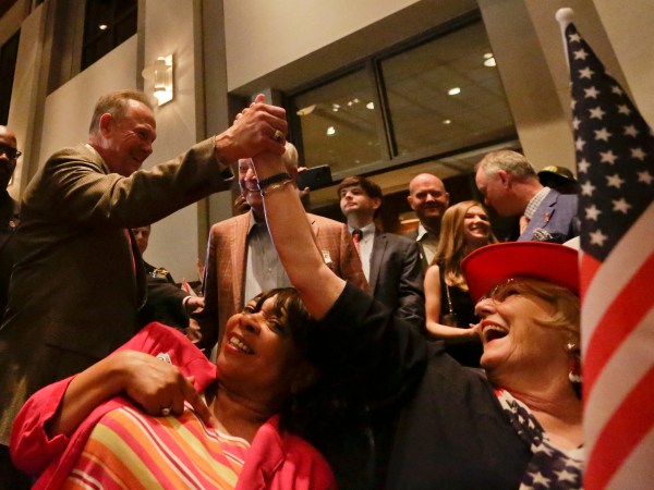 Former Alabama Chief Justice and U.S. Senate candidate Roy Moore, greets supporter Patricia Jones, right, before his election party, Tuesday, Sept. 26, 2017, in Montgomery, Ala.(AP Photo/Brynn Anderson)