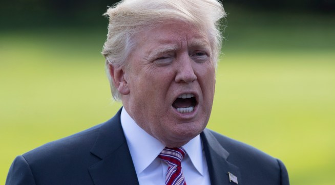 President Donald Trump talks to media as he walks across the South Lawn of the White House in Washington, Friday, Sept. 29, 2017, to Marine One for the short trip to Andrews Air Force Base en route to Bedminster, N.J.. (AP Photo/Carolyn Kaster)