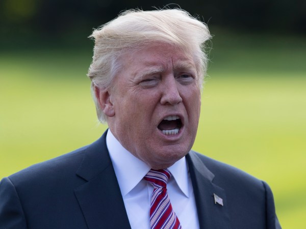 President Donald Trump talks to media as he walks across the South Lawn of the White House in Washington, Friday, Sept. 29, 2017, to Marine One for the short trip to Andrews Air Force Base en route to Bedminster, N.J.. (AP Photo/Carolyn Kaster)
