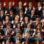 Members of a youth choir raise their hands during a sustaining vote during the afternoon session of the two-day Mormon church conference Saturday, Sept. 30, 2017, in Salt Lake City.  (AP Photo/Rick Bowmer)