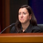 Assemblywoman Nily Rozic, D-Fresh Meadows, listens to a speaker during an Assembly oversight hearing on the state prison system on Wednesday, Dec. 2, 2015, in Albany, N.Y. (AP Photo/Mike Groll)