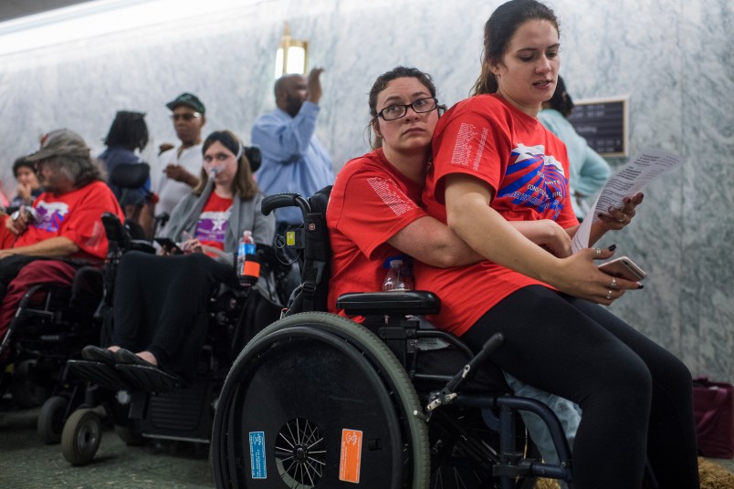UNITED STATES - SEPTEMBER 25: Shaylin Sluzalis, right, and her sister Brittani, who has cerebral palsy, wait in line for a Senate Finance Committee hearing in Dirksen on the proposal by Sens. Lindsey Graham,R-S.C., and Bill Cassidy, R-La., to repeal and replace the Affordable Care Act, which they oppose, on September 25, 2017. Both senators are scheduled to testify. (Photo By Tom Williams/CQ Roll Call)
