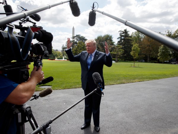 President Donald Trump talks to reporters as he walks to board Marine One on the South Lawn of the White House, Wednesday, Sept. 27, 2017, in Washington. (AP Photo/Evan Vucci)