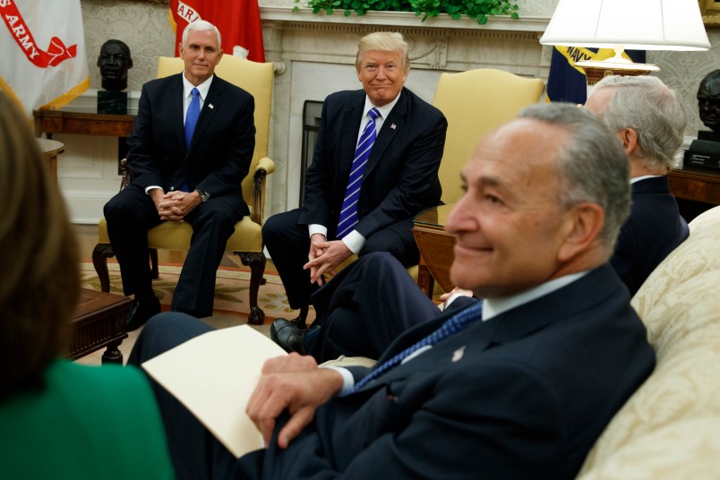 Vice President Mike Pence looks on as President Donald Trump speaks during a meeting with Senate Minority Leader Chuck Schumer, D-N.Y., and other Congressional leaders in the Oval Office of the White House, Wednesday, Sept. 6, 2017, in Washington. (AP Photo/Evan Vucci)