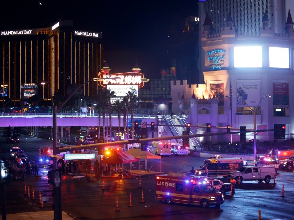 Las Vegas Metro Police and medical workers stage in the intersection of Tropicana Avenue and Las Vegas Boulevard South after a mass shooting at a music festival on the Las Vegas Strip Sunday, Oct. 1, 2017. (AP Photo / Las Vegas Sun, Steve Marcus)