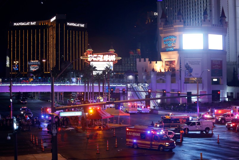 Las Vegas Metro Police and medical workers stage in the intersection of Tropicana Avenue and Las Vegas Boulevard South after a mass shooting at a music festival on the Las Vegas Strip Sunday, Oct. 1, 2017. (AP Photo / Las Vegas Sun, Steve Marcus)