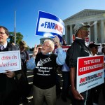 Eric Silberman from Silver Spring, Md., from left,Charlie Cooper from Baltimore, Md., and Clay Wilson from Alexandria, Va., join others in a rally for a fair election outside the U.S. Supreme Court in Washington, Tuesday, Oct. 3, 2017. The Supreme Court hears arguments in a case about political maps in Wisconsin that could affect elections across the country. (AP Photo/Manuel Balce Ceneta)