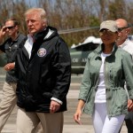 President Donald Trump and first lady Melania Trump walk after arrival at the Luis Muñiz Air National Guard Base in San Juan, Puerto Rico, Tuesday, Oct. 3, 2017. Trump is visiting Puerto Rico in the wake of Hurricane Maria.(AP Photo/Ramon Espinosa)