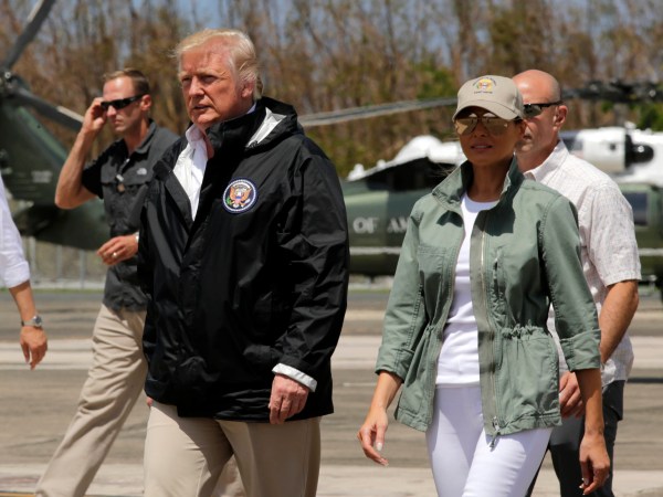 President Donald Trump and first lady Melania Trump walk after arrival at the Luis Muñiz Air National Guard Base in San Juan, Puerto Rico, Tuesday, Oct. 3, 2017. Trump is visiting Puerto Rico in the wake of Hurricane Maria.(AP Photo/Ramon Espinosa)