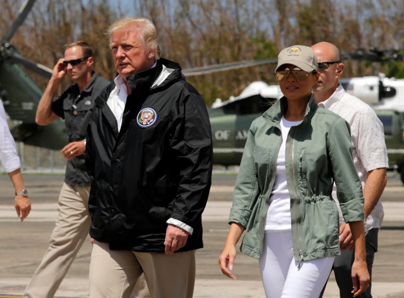 President Donald Trump and first lady Melania Trump walk after arrival at the Luis Muñiz Air National Guard Base in San Juan, Puerto Rico, Tuesday, Oct. 3, 2017. Trump is visiting Puerto Rico in the wake of Hurricane Maria.(AP Photo/Ramon Espinosa)