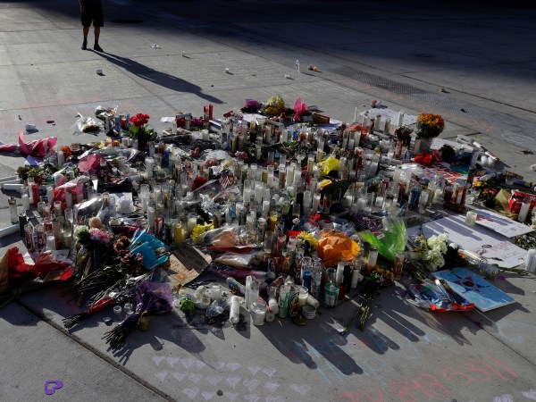 A man pauses at a memorial for the victims of a mass shooting in Las Vegas, Wednesday, Oct. 4, 2017, in Las Vegas. (AP Photo/Marcio Jose Sanchez)