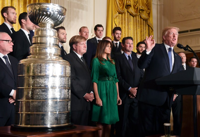 President Donald Trump stands with the 2017 NHL Stanley Cup Champions Pittsburgh Penguins in the East Room of the House in Washington, Tuesday, Oct. 10, 2017. (AP Photo/Susan Walsh)