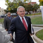 New Jersey Senator Robert Menendez greets supporters as he arrives to court in Newark, N.J., Monday, Oct. 16, 2017. The judge in Menendez's corruption trial could rule on Monday to dismiss the bulk of the indictment against the New Jersey Democrat, a decision that prosecutors say could "broadly legalize pay-to-play politics." (AP Photo/Seth Wenig)
