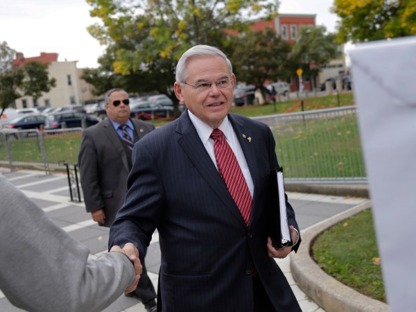 New Jersey Senator Robert Menendez greets supporters as he arrives to court in Newark, N.J., Monday, Oct. 16, 2017. The judge in Menendez's corruption trial could rule on Monday to dismiss the bulk of the indictment against the New Jersey Democrat, a decision that prosecutors say could "broadly legalize pay-to-play politics." (AP Photo/Seth Wenig)