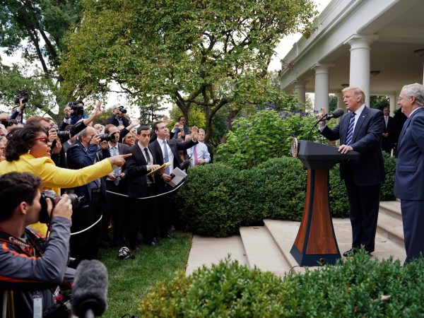 April Ryan, left, the Washington bureau chief for American Urban Radio Networks gestures as she asks questions to President Donald Trump and Senate Majority Leader Mitch McConnell of Ky., in the Rose Garden of the White House, Monday, Oct. 16, 2017. (AP Photo/Pablo Martinez Monsivais)