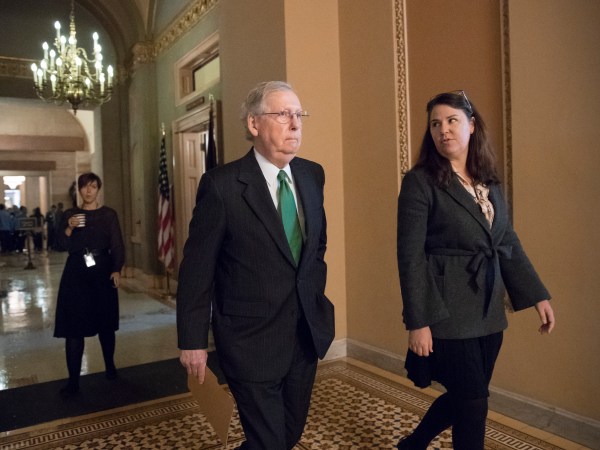 Senate Majority Leader Mitch McConnell, R-Ky., joined at right by Secretary for the Majority Laura Dove, walks from his office to the chamber for the start of the legislative day, at the Capitol in Washington, Tuesday, Oct. 17, 2017. Monday, President Donald Trump and Mitch McConnell reaffirmed their alliance of necessity in a raucous Rose Garden news conference that also underscored their sharp differences. (AP Photo/J. Scott Applewhite)