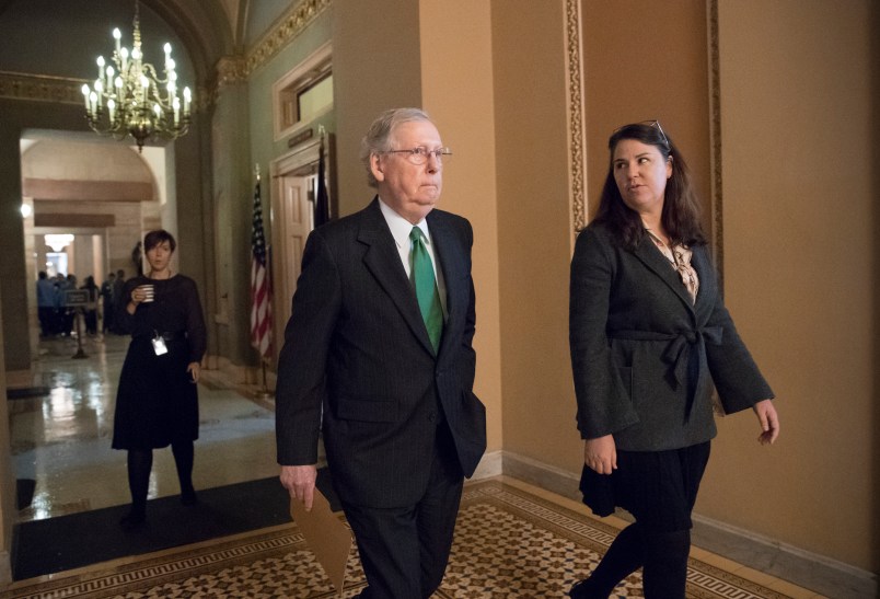 Senate Majority Leader Mitch McConnell, R-Ky., joined at right by Secretary for the Majority Laura Dove, walks from his office to the chamber for the start of the legislative day, at the Capitol in Washington, Tuesday, Oct. 17, 2017. Monday, President Donald Trump and Mitch McConnell reaffirmed their alliance of necessity in a raucous Rose Garden news conference that also underscored their sharp differences. (AP Photo/J. Scott Applewhite)