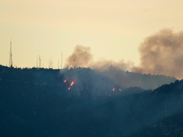 A 15 acre brush fire burns near the summit of Mt. Wilson early Tuesday morning.  Fire crews were hoping to get control of the slow burning fire before it threatened any homes or structures in the area on Tuesday, October 17, 2017.  ( Photo by David Crane, Los Angeles Daily News/SCNG)