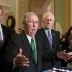 Senate Majority Leader Mitch McConnell, R-Ky., flanked by Sen. John Thune, R-S.D., left, and Majority Whip John Cornyn, R-Texas, announces to reporters that the Senate is moving ahead on a Republican budget plan, a critical step in President Donald Trump and the party's politically imperative drive to cut taxes and simplify the IRS code, at the Capitol in Washington, Tuesday, Oct. 17, 2017.  (AP Photo/J. Scott Applewhite)