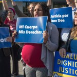 Activists with Planned Parenthood demonstrate in support of "Jane Doe," a pregnant 17-year-old being held in a Texas facility for unaccompanied immigrant children to obtain an abortion, outside of the Department of Health and Human Services in Washington, Friday, Oct. 20, 2017. (AP Photo/J. Scott Applewhite)