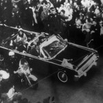 This overhead view of President Kennedy's car in Dallas motorcade on Nov. 22, 1963, was Warren Commission Exhibit No. 698. Special agent Clinton J. Hill is shown riding atop the rear of the limousine. The Warren Commission said agent Hil had to leave the left front running board of the President's follow-up car four times because of dense crowds to ride on the rear of the presidential limousine. (AP Photo)