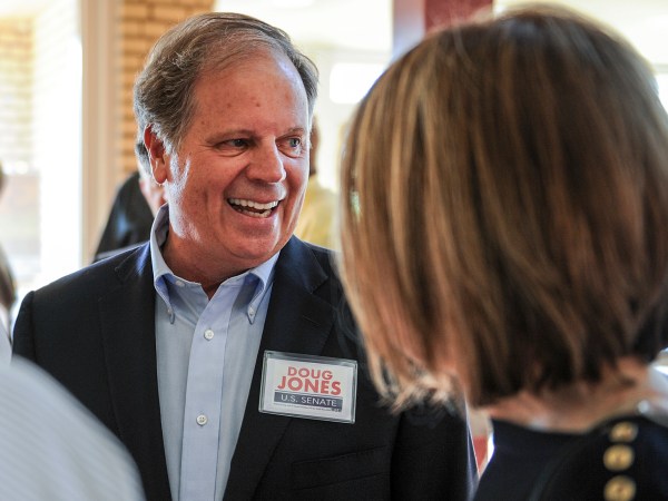 Candidate Doug Jones chats with constituents before a Democratic Senate candidate forum at the Princess Theatre in Decatur, Ala. Thursday, Aug. 3, 2017. (Jeronimo Nisa /The Decatur Daily via AP)