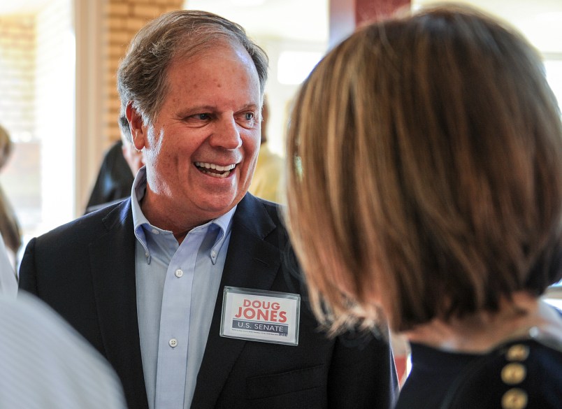 Candidate Doug Jones chats with constituents before a Democratic Senate candidate forum at the Princess Theatre in Decatur, Ala. Thursday, Aug. 3, 2017. (Jeronimo Nisa /The Decatur Daily via AP)