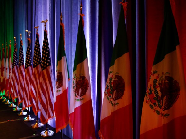 The flags of Canada, the U.S. and Mexico are lit by stage lights before a news conference, Wednesday, Aug. 16, 2017, at the start of NAFTA renegotiations in Washington. (AP Photo/Jacquelyn Martin)