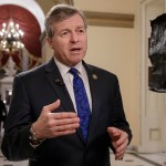 Rep. Charlie Dent, R-Pa., a key moderate in the health care bill debate, explains why he would be voting "no" on the Obamacare replacement, Thursday, March 23, 2017, on Capitol Hill in Washington. House Speaker Paul Ryan and the Republican leadership are scrambling for votes on their health care overhaul in the face of opposition from reluctant conservatives in the House Freedom Caucus, such as Rep. Ted Yoho, R-Fla., being interviewed at right. (AP Photo/J. Scott Applewhite)