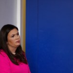 White House press secretary Sarah Huckabee Sanders stands off to the side during a news briefing at the White House, in Washington, Friday, Sept. 15, 2017. (AP Photo/Carolyn Kaster)