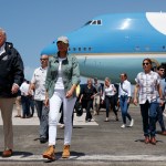 President Donald Trump and first lady Melania Trump arrive at Luis Muniz Air National Guard Base to survey hurricane damage and recovery efforts, Tuesday, Oct. 3, 2017, in San Juan, Puerto Rico. (AP Photo/Evan Vucci)