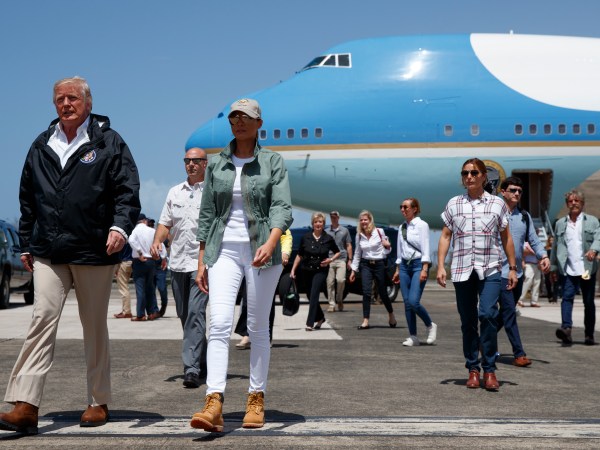 President Donald Trump and first lady Melania Trump arrive at Luis Muniz Air National Guard Base to survey hurricane damage and recovery efforts, Tuesday, Oct. 3, 2017, in San Juan, Puerto Rico. (AP Photo/Evan Vucci)