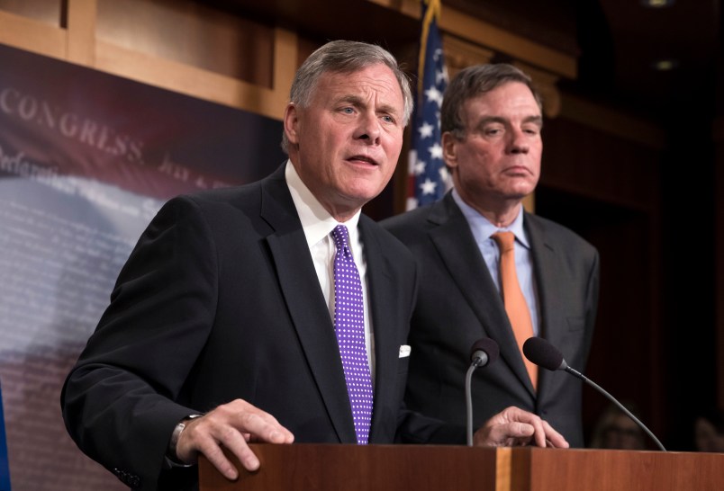 Senate Select Committee on Intelligence Chairman Richard Burr, R-N.C., left, and Vice Chairman Mark Warner, D-Va., update reporters on the status of their inquiry into Russian interference in the 2016 U.S. elections, at the Capitol in Washington, Wednesday, Oct. 4, 2017. Burr says the committee has interviewed more than 100 witnesses as part of its investigation and that more work still needs to be done.  (AP Photo/J. Scott Applewhite)