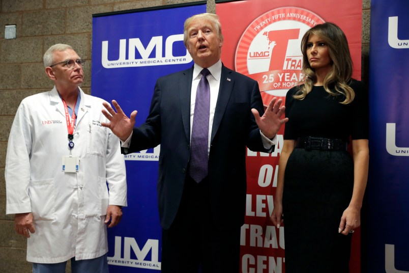 President Donald Trump and first lady Melania Trump meet with first responders and private citizens that helped during the mass shooting, Wednesday, Oct. 4, 2017, in Las Vegas. (AP Photo/Evan Vucci)