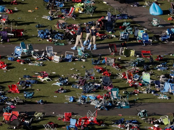 Agents from the FBI continue to process evidence at the scene of a mass shooting on Wednesday, Oct. 4, 2017, in Las Vegas. A gunman opened fire on an outdoor music concert on Sunday killing dozens and injuring hundreds. (AP Photo/Gregory Bull)