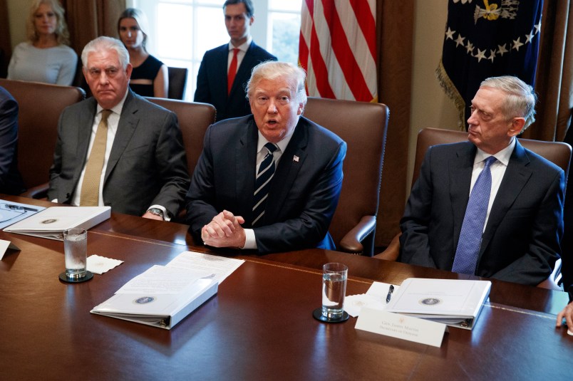 Secretary of State Rex Tillerson, left, and Secretary of Defense Jim Mattis, right, listen as President Donald Trump speaks during a cabinet meeting at the White House, Monday, Oct. 16, 2017, in Washington. (AP Photo/Evan Vucci)