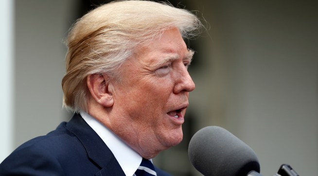 President Donald Trump speaks as he stands next Senate Majority Leader Mitch McConnell of Ky., after their meeting at the White House, Monday, Oct. 16, 2017, in Washington. (AP Photo/Alex Brandon)
