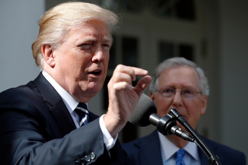 President Donald Trump speaks as he stands next Senate Majority Leader Mitch McConnell of Ky., after their meeting at the White House, Monday, Oct. 16, 2017, in Washington. (AP Photo/Alex Brandon)
