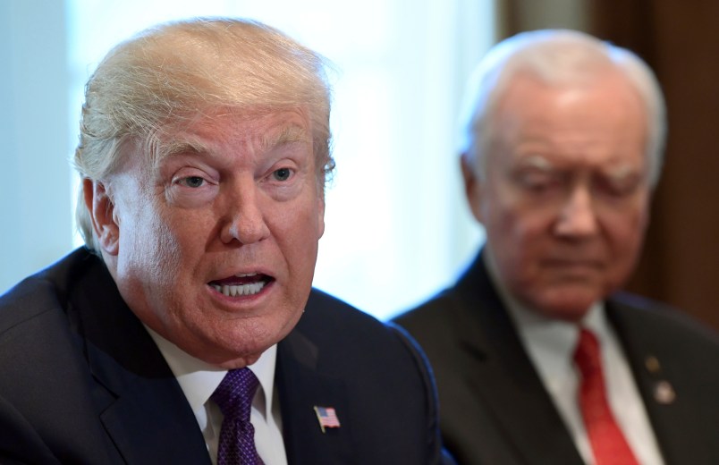 President Donald Trump, left, sitting next to Senate Finance Committee Chairman Sen. Orrin Hatch, R-Utah, right, speaks during a meeting of the committee and members of the President's economic team in the Cabinet Room of the White House in Washington, Wednesday, Oct. 18, 2017. (AP Photo/Susan Walsh)