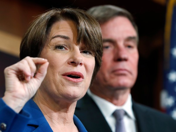 Sen. Amy Klobuchar, D-Minn., left, and Sen. Mark Warner, D-Va., speak about online political ads and preventing foreign interference in U.S. elections, during a news conference, Thursday, Oct. 19, 2017, on Capitol Hill in Washington. (AP Photo/Jacquelyn Martin)