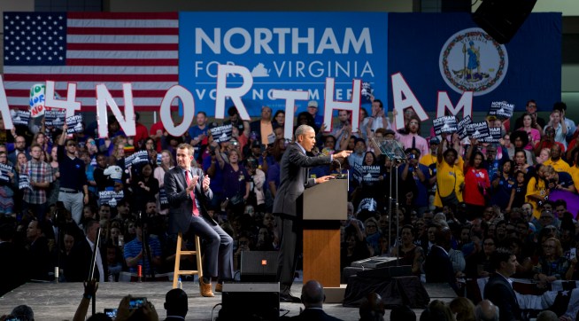 Former President Barack Obama, right, gestures during a rally with Democratic gubernatorial candidate Lt. Gov., Ralph Northam, in Richmond, Va., Thursday, Oct. 19, 2017.  (AP Photo/Steve Helber)